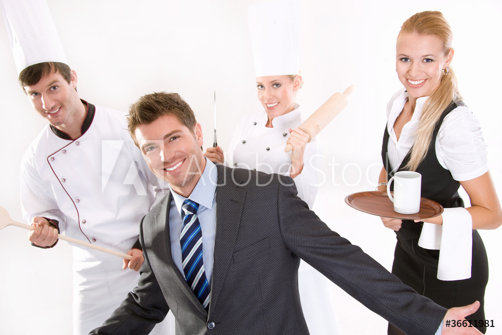A group of people standing around one another